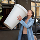 Woman drinking giant coffee